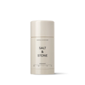 A stick of salt & stone deodorant against a neutral background.